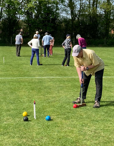 Playing croquet